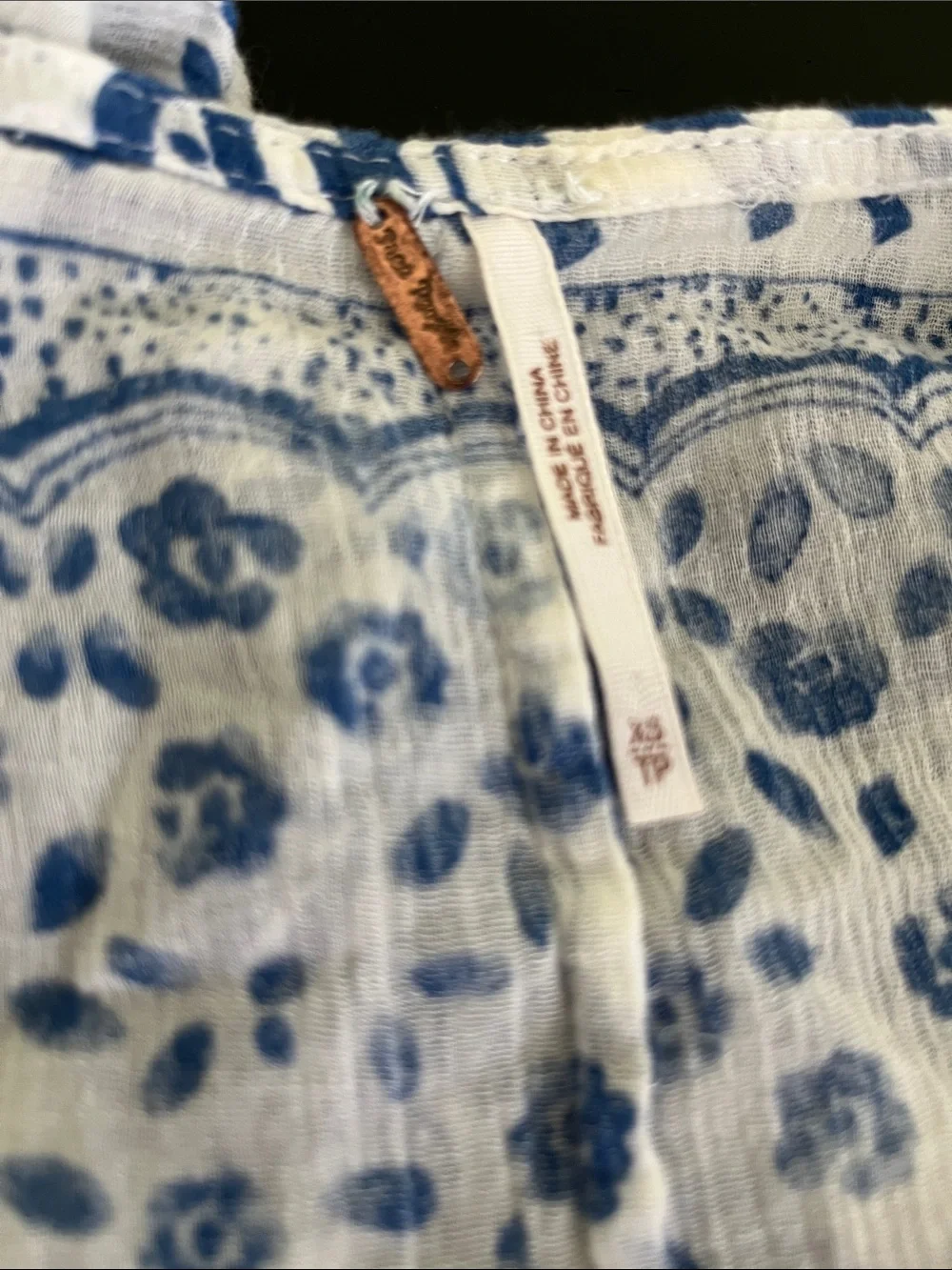 Free People boho top featuring a blue and white geo-paisley print
